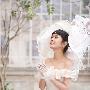 组图：张娜拉拍最新婚纱写真 时而娇俏时而优雅