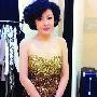 哈文抹胸礼服照曝光 女强人变柔美妈妈(组图)