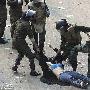 埃及军民冲突不断 军警凌辱妇女引发争议